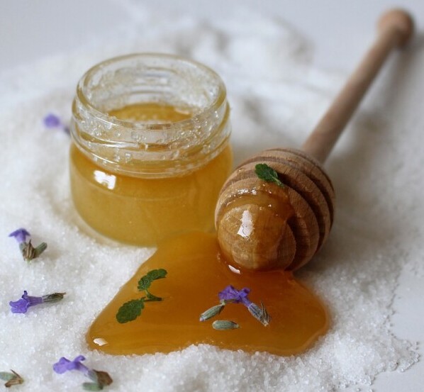 A jar of honey in which liquid form on top of crystallised honey